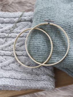 Upcycling ideas for sorted out Christmas sweaters and knitted scarves.