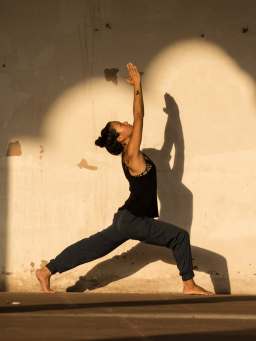 History of yoga - a group doing yoga.
