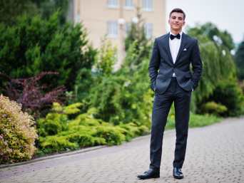 Prom clothes: a young man showing off his suit for prom. Prom clothes: a young man showing off his suit for prom.