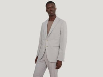 Choosing the right suit colour: a man wearing a light coloured suit. Choosing the right suit colour: a man wearing a light coloured suit.