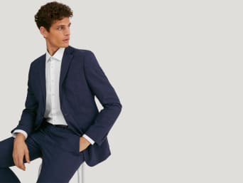 Different suit colours: a man wearing a blue suit. Different suit colours: a man wearing a blue suit.