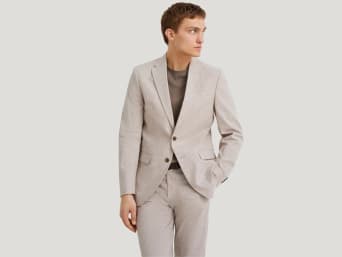 Beige suits: a man wearing a beige suit. Beige suits: a man wearing a beige suit.