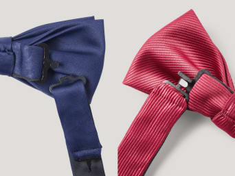 Tying a pre-tied bow tie: a close-up shot of a tied bow tie. Tying a pre-tied bow tie: a close-up shot of a tied bow tie.