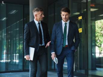 What is business professional attire? Two men are wearing formal business attire. What is business professional attire? Two men are wearing formal business attire.