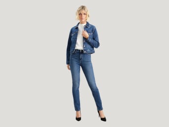 What are slim fit jeans – a woman wearing a pair of slim fit jeans. What are slim fit jeans – a woman wearing a pair of slim fit jeans.