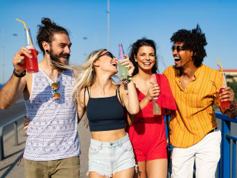 Bright festival outfits for men: a group of friends on their way to a festival. Bright festival outfits for men: a group of friends on their way to a festival.
