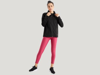 Water sports clothing: a woman wearing waterproof functional clothing. Water sports clothing: a woman wearing waterproof functional clothing.