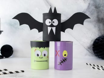 Making Halloween decorations with children: by using some empty tins you can create some spooky monsters or bats. Making Halloween decorations with children: by using some empty tins you can create some spooky monsters or bats.