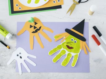 Making Halloween window decorations: Halloween decorations made from cut-out handprints. Making Halloween window decorations: Halloween decorations made from cut-out handprints.