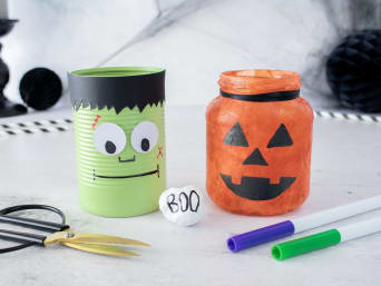 Make your own Halloween decorations: different crafted Halloween decorations on a table. Make your own Halloween decorations: different crafted Halloween decorations on a table.