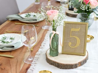 Wedding table decorations: gold framed table numbers on a table. Wedding table decorations: gold framed table numbers on a table.