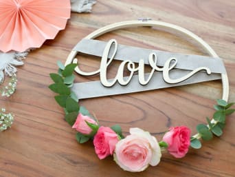 Homemade wedding decorations: a wedding wreath on an embroidery hoop with flowers. Homemade wedding decorations: a wedding wreath on an embroidery hoop with flowers.