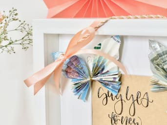 Wedding gift inspiration: folded butterflies made out of two folded notes.  Wedding gift inspiration: folded butterflies made out of two folded notes.