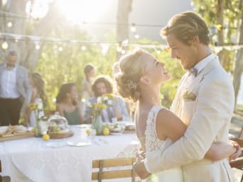 Themed weddings: a bride and groom celebrating their wedding in a garden. Themed weddings: a bride and groom celebrating their wedding in a garden.
