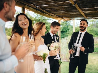 Wedding games: a group of wedding guests laughing. Wedding games: a group of wedding guests laughing.