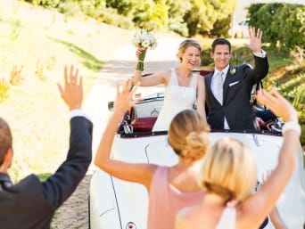 Wedding planning made easy: a bride and groom sitting in a wedding car. Wedding planning made easy: a bride and groom sitting in a wedding car.