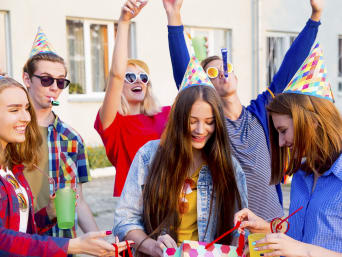 Children's gift from the age of 12. A teen celebrates her birthday with friends. Children's gift from the age of 12. A teen celebrates her birthday with friends.