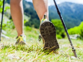 Nordic walking: a close-up of Nordic walking shoes and poles. Nordic walking: a close-up of Nordic walking shoes and poles.