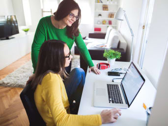 Mother and child working at a computer. Mother and child working at a computer.