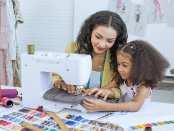Quilting for beginners: a girl practicing sewing for her first patchwork project. Quilting for beginners: a girl practicing sewing for her first patchwork project.