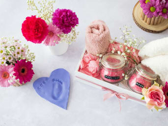 Mother's Day gift crafting - Mother's Day gifts on a table. Mother's Day gift crafting - Mother's Day gifts on a table.