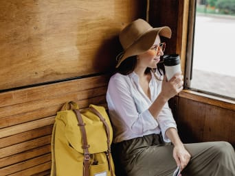 Travelling light: tourist travelling with a rucksack on a train. Travelling light: tourist travelling with a rucksack on a train.