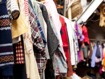 A sustainable approach to buying new clothes: a clothes rack in a second-hand shop. A sustainable approach to buying new clothes: a clothes rack in a second-hand shop.