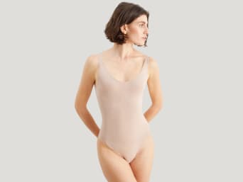 Different types of shapewear: a woman wearing shapewear in beige. Different types of shapewear: a woman wearing shapewear in beige.