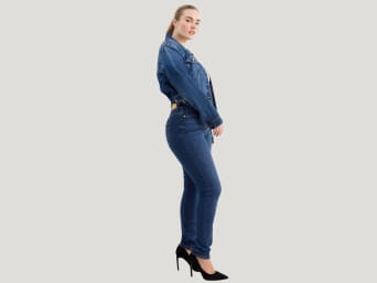 Shaping jeans: a woman wearing a pair of shaping jeans. Shaping jeans: a woman wearing a pair of shaping jeans.
