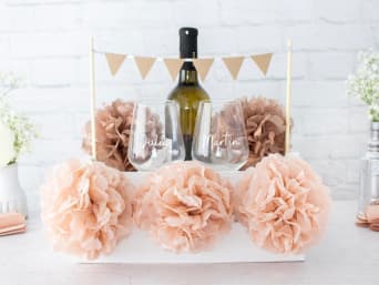 Last-minute silver wedding anniversary gift: a wrapped gift basket for the happy couple. Last-minute silver wedding anniversary gift: a wrapped gift basket for the happy couple.