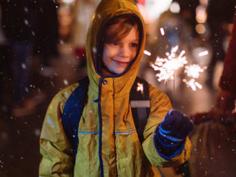 New Year’s Eve with kids: Having fun with sparklers. New Year’s Eve with kids: Having fun with sparklers.