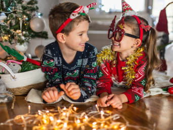 New Year’s Eve Games Kids: Two siblings dressed up for New Year’s Eve. New Year’s Eve Games Kids: Two siblings dressed up for New Year’s Eve.