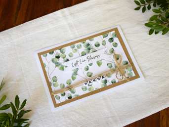 Baptism card: a homemade christening card with jute string and a name bracelet. Baptism card: a homemade christening card with jute string and a name bracelet.