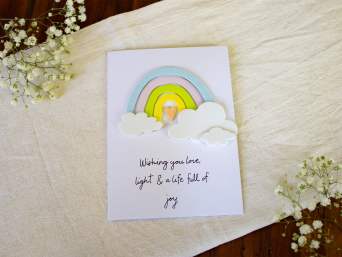 A greeting card for a christening with a rainbow design. A greeting card for a christening with a rainbow design.