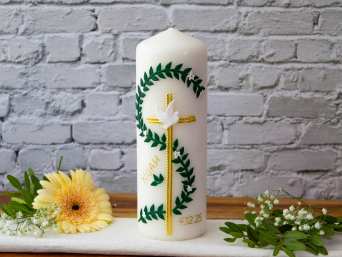 A baptism candle with a vine, cross and dove.   A baptism candle with a vine, cross and dove.