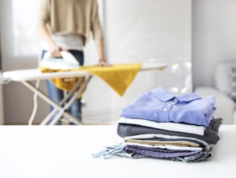 Ironing and folding clothes. Ironing and folding clothes.
