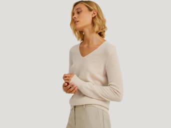 Different types of wool: a woman in a cashmere jumper. Different types of wool: a woman in a cashmere jumper.