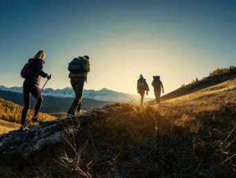 A hiking group walking on a path in a valley. A hiking group walking on a path in a valley.