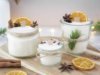 Making your own scented candles – finished homemade scented candles presented as a Christmas present. Making your own scented candles – finished homemade scented candles presented as a Christmas present.
