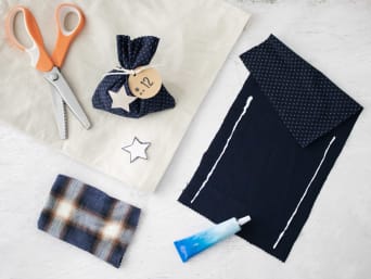 Handmade little Advent calendar satchels: the little Advent calendar bags have been made using textile glue. Handmade little Advent calendar satchels: the little Advent calendar bags have been made using textile glue.
