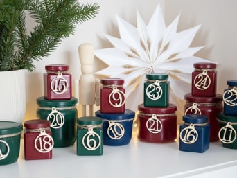 Reusable Advent calendars – using painted old glass jars as an Advent calendar. Reusable Advent calendars – using painted old glass jars as an Advent calendar.