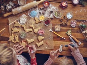 Baking Christmas biscuits with children: children decorating Christmas biscuits. Baking Christmas biscuits with children: children decorating Christmas biscuits.