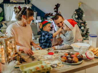 Biscuit recipes for children – a family at Christmas time baking biscuits together. Biscuit recipes for children – a family at Christmas time baking biscuits together.