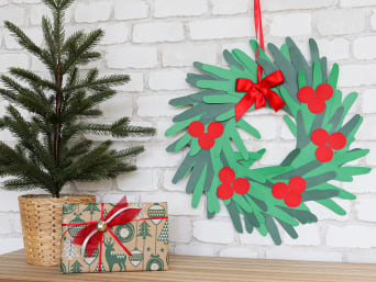Christmas crafting with kids: a Christmas wreath made from handprints in various shades of green. Christmas crafting with kids: a Christmas wreath made from handprints in various shades of green.