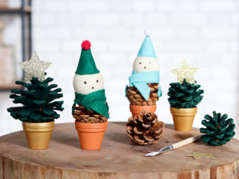 Christmas crafting with kids: cute Christmas decorations made from painted and decorated pine cones. Christmas crafting with kids: cute Christmas decorations made from painted and decorated pine cones.
