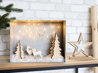 Christmas crafting with kids: a snowy landscape with starry sky made from an old cardboard box. Christmas crafting with kids: a snowy landscape with starry sky made from an old cardboard box.