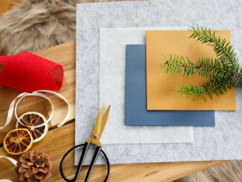 Materials for homemade Christmas cards with a felt star or fir sprig. Materials for homemade Christmas cards with a felt star or fir sprig.