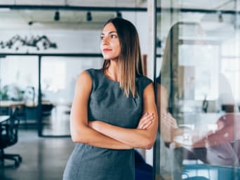 Business dress codes explained: a businesswoman sporting a modern office wear look.  Business dress codes explained: a businesswoman sporting a modern office wear look.