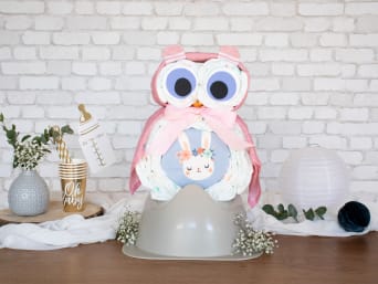 Gift for baby girl: an owl nappy cake in pink and purple. Gift for baby girl: an owl nappy cake in pink and purple.
