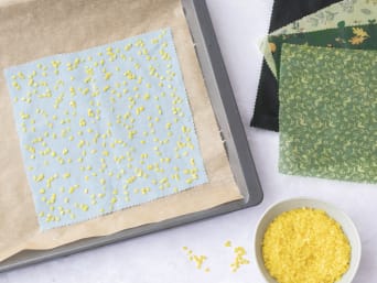 Instructions on beeswax wraps: pieces of fabric with beeswax on a baking tray. Instructions on beeswax wraps: pieces of fabric with beeswax on a baking tray.